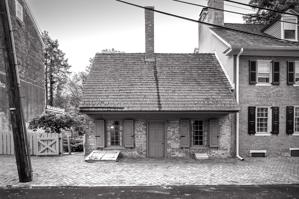 Street front; ca. 1700 and bricked in 1795
